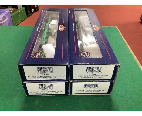 Four Boxed Bachmann OO Gauge Intermodal Bogie Wagons with a selection of containers.Missing some containers, some couplings c
