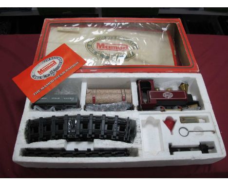 A Mamod Steam Railway Company 'O' Gauge Live Steam Train Set. Comprising of 'O' Gauge 0-4-0 Locomotive, Open Wagon, Logs Wago