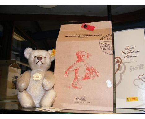 A modern Steiff teddy bear with original box