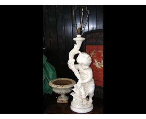 A small wrought iron urn, together with a decorative cherub table lamp