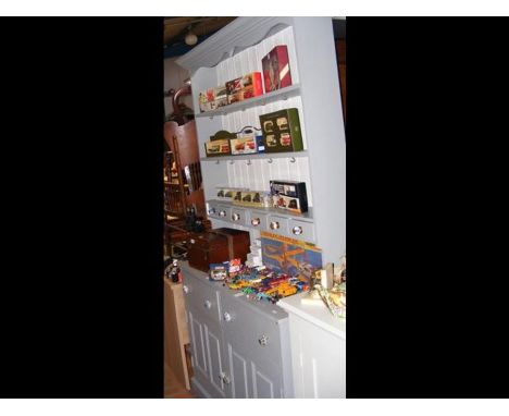 A grey painted dresser, rack to back with spice drawers, drawers and cupboards under - width 125cm 