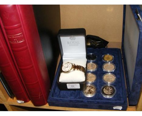 A History of WWII First Day Covers in two volumes together with collectable coinage and wrist watch