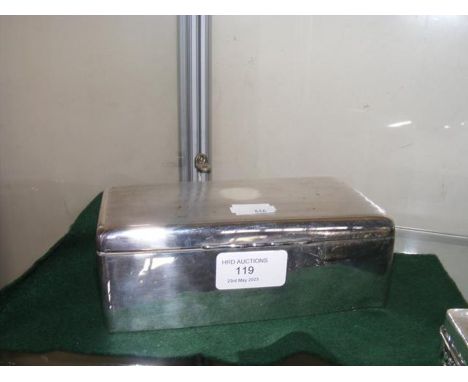 A silver cigarette box with engine turned lid 