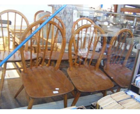 A set of six stick back Ercol dining chairs