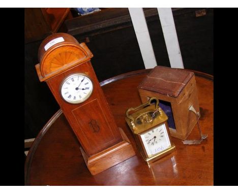A miniature long case clock by White, 33cms high, together with a carriage clock in travelling case