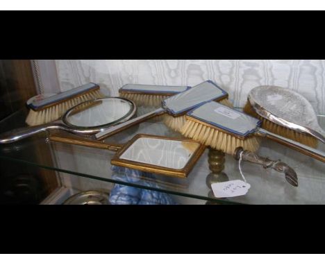 A silver back hand mirror, together with the matching brush, together with various brushes and mirror, 'horse's hoof' pipe ta