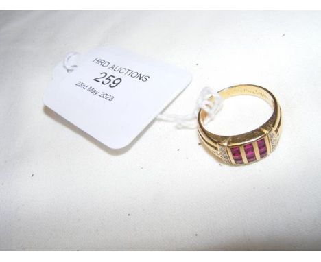 A ruby and diamond ring in 18ct setting