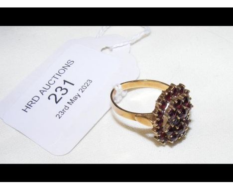 A garnet cluster ring in 14ct setting