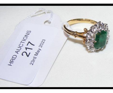 An attractive baguette cut emerald and diamond ring in 18ct settingCONDITION REPORTSize S/T