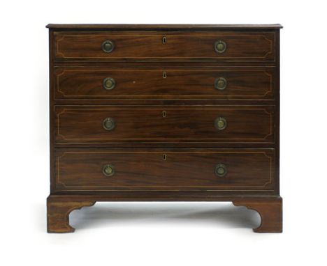 A George IV mahogany and strung chest of four graduated drawers, the top drawer opening to reveal a fitted interior with a fo