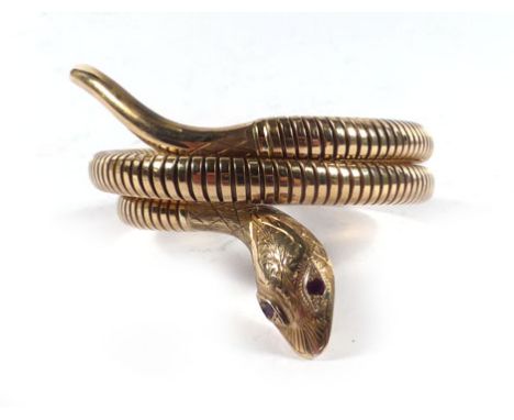 A part 9ct yellow gold coil type serpent bracelet, maker C&F, Birmingham 1975   CONDITION REPORT:  This bracelet has been des