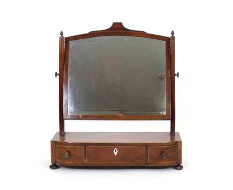 A 19th century walnut and strung mirror, the adjustable plate on reeded supports over a bow fronted base with three drawers o