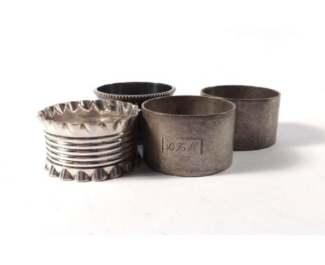 A pair of silver engine turned napkin rings and two plated napkin rings (4)   CONDITION REPORT:  With tarnishing and minor we