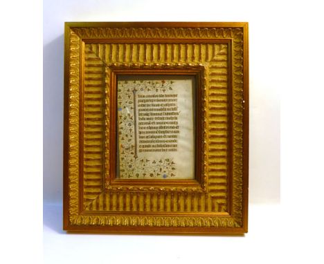 Medieval written Latin manuscript on vellum. A single leaf from a religious/theological work featuring decorative marginal fl