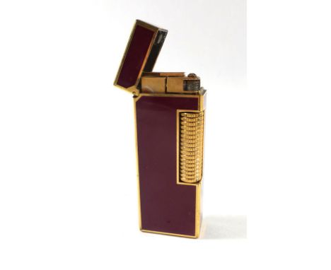 A Swiss lighter in a leather case by Dunhill