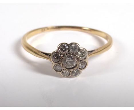 An 18ct yellow gold ring set nine diamonds in a flowerhead setting, ring size R,1.4 gms