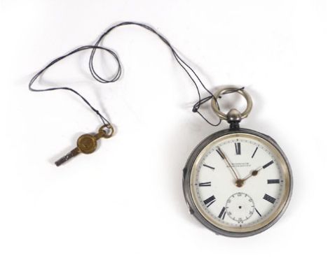 A silver cased open face pocket watch by F. Woodcock, Shaftesbury, the white enamel dial with black Roman numerals and second