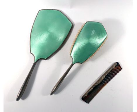 A silver and pale green gillouche enamelled hand mirror and matching hairbrush, together with a silver mounted comb (3)   CON