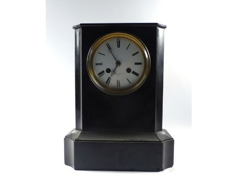 A Victorian mantle clock striking on a bell, the enamelled face with Roman numerals by Phillips of Paris, within a marble and