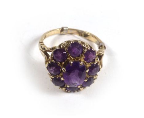 A 19th century-style 9ct yellow gold ring set amethyst within a flowerhead setting, ring size P,5.1 gms