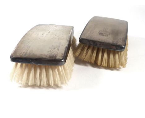 A cased pair of silver backed engine turned hairbrushes of rectangular form, maker L Ltd., Birmingham 1956   CONDITION REPORT