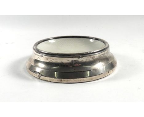 A silver mounted ceramic dish of circular form, maker HW Ltd, Birmingham 1917, d. 12.5 cm   CONDITION REPORT:  Heavy dents an