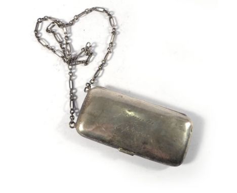 An early 20th century silver and parcel gilt ladies cigarette case opening to reveal a powder and mirror section and suspende