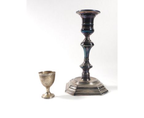 A silver candlestick of typical knopped form on an octagonal base, James Dixon & Sons, Sheffield 1967, h. 18 cm, loaded, toge