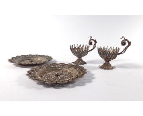 A pair of filigree work saucers of circular form and a pair of matching cup sleeves   CONDITION REPORT:  With tarnishing and 