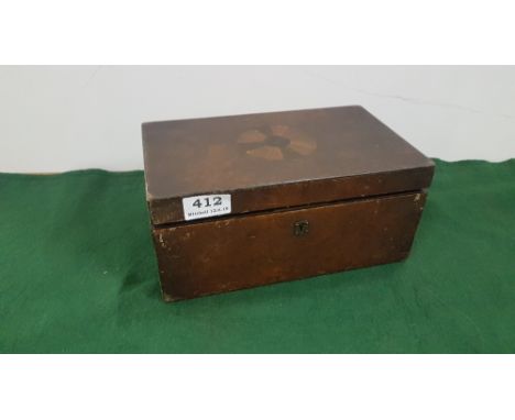 Regency Period Walnut Tea Caddy, the hinged lid enclosing two tin-lined compartments, the central segmented inlay engraved on