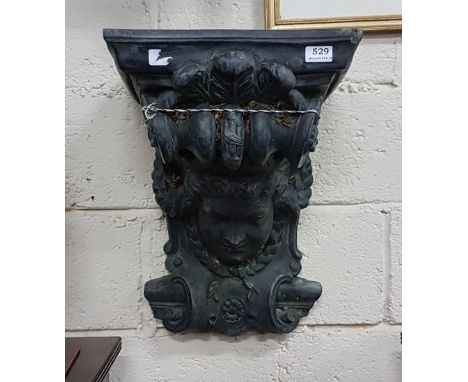 Stone faced Wall Bracket/Sconce, green patinated, mask of a classic shaped man, 55cm h x 38cm w