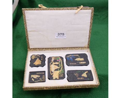 Vintage Chinese 5-piece storey/puzzle tablets, engraved with Chinese figures and lettering, in original presentation box 