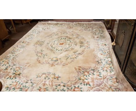 Large Chinese Wool Carpet, pink ground, green floral borders, centre floral medallion, 3.7m x 2.8m