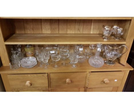 Shelf of Glassware – champagne glasses, punch glasses, decanters etc