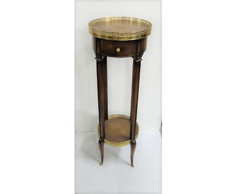 Mahogany Finish Circular Jardinière Stand, with brown leatherette covered top, (brass gallery) and stretcher shelf, on taperi