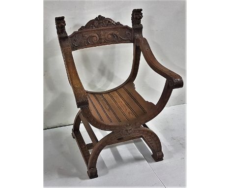 Oak “Throne” Armchair with lion mask finials, with carved panel on C shaped base and carved stretcher, 24”w x 33”h x 21”d