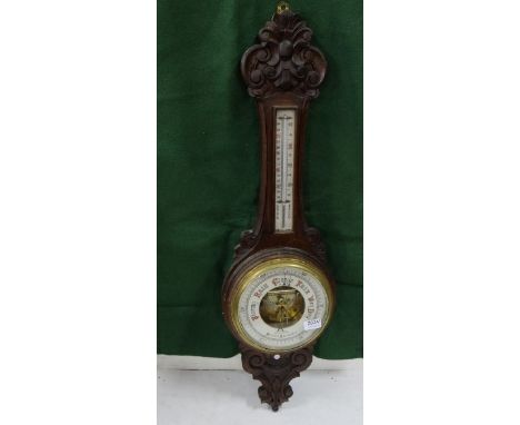 Oak cased wall mounted aneroid Barometer, stamped WEIR &amp; SONS, DUBLIN, carved oak frame, 89cm h