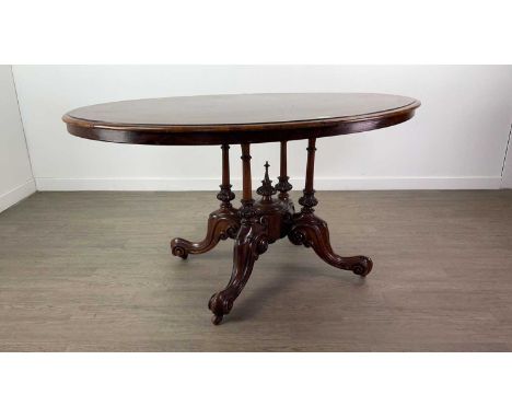 VICTORIAN WALNUT BREAKFAST TABLE,the oval burr top with marquetry decoration, on turned supports to four outswept scroll legs