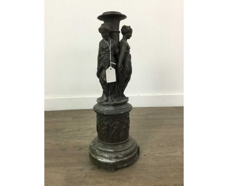 VICTORIAN SPELTER FIGURAL CANDLESTICK,modelled as the three graces, 48cm highVery dirty and dusty, some surface pitting, rubb