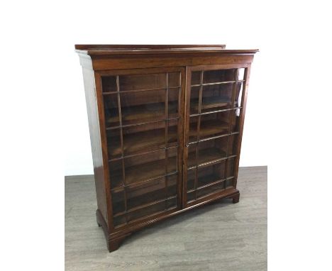 VICTORIAN MAHOGANY TWO DOOR BOOKCASE, with two glazed doors, shelved interior and on bracket feet, 127cm wide