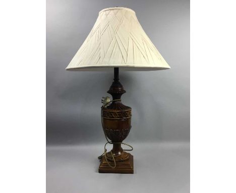 REPRODUCTION CARVED WALNUT TABLE LAMP,of urn-form, raised on a stepped square base, 82cm including shade