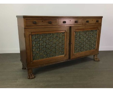 MAHOGANY SIDE CABINET OF REGENCY DESIGN,with three short drawers above twin fielded doors bearing pierced grills embellished 