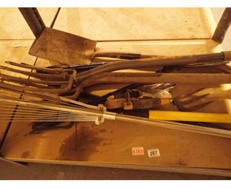 Selection of garden tools shears rake spade etc