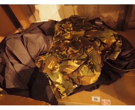 Shelf of military clothing including camoflauge