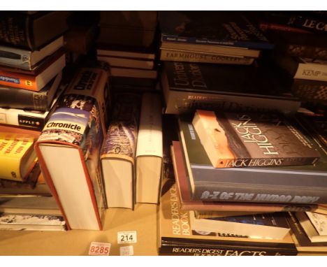 Shelf of assorted fact and fiction books mostly hardback
