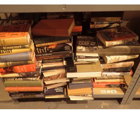 Shelf of assorted fact and fiction books mostly hardback