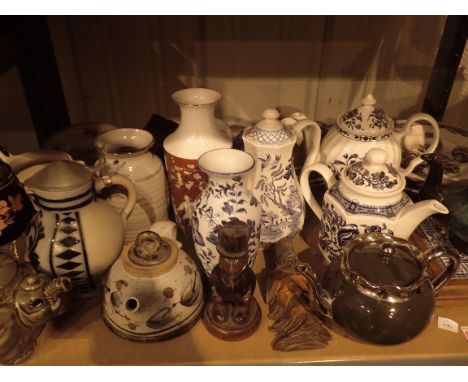 Shelf of mixed household ceramics