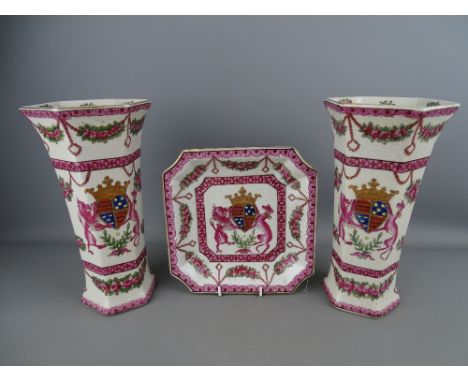 Pair of crackle glazed vases and a shallow dish, all with crested coat of arms detail, 25.5 cms high the vases, 19.5 cms wide