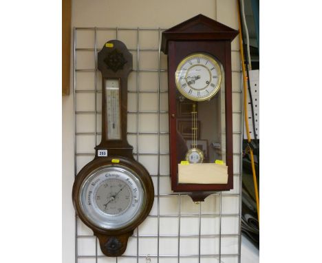 Polished balloon barometer and a modern Vienna style wall clock