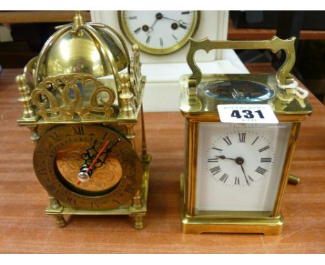 20th Century brass cased four pane carriage clock with key and a reproduction brass lantern clock with Quartz movement